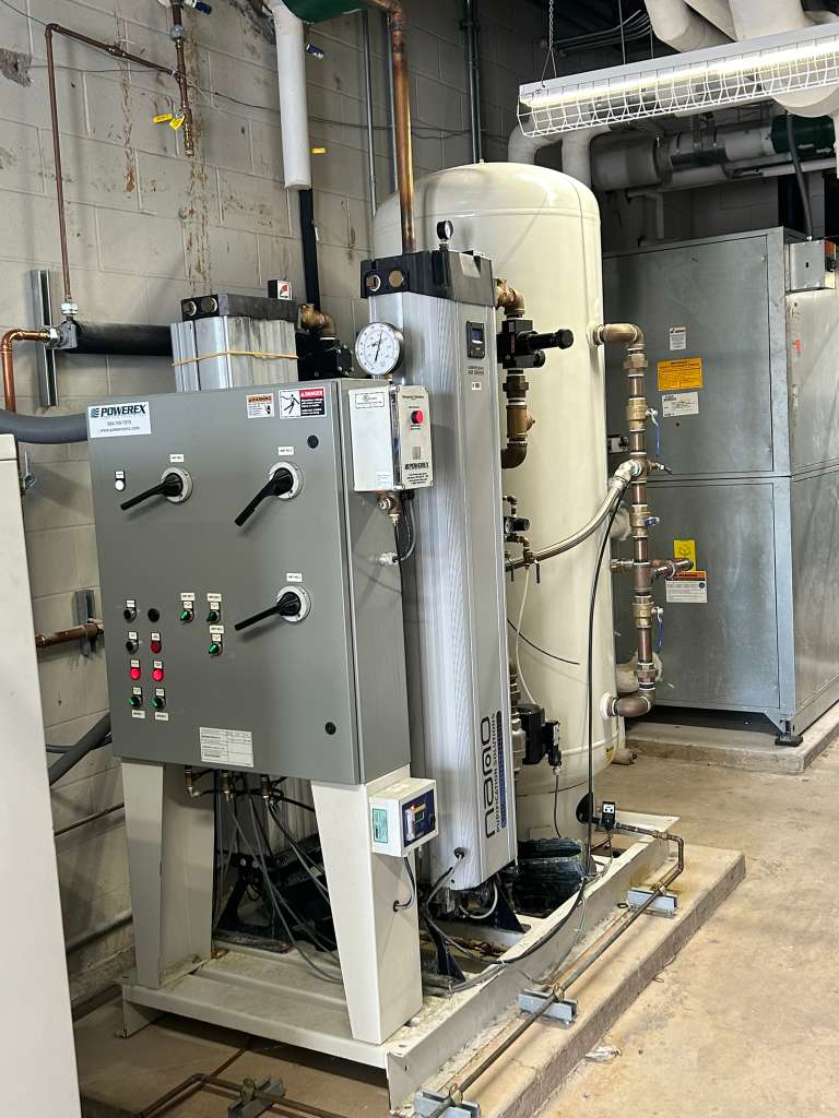 Industrial air installation with pressure gauge, valves, piping and controls